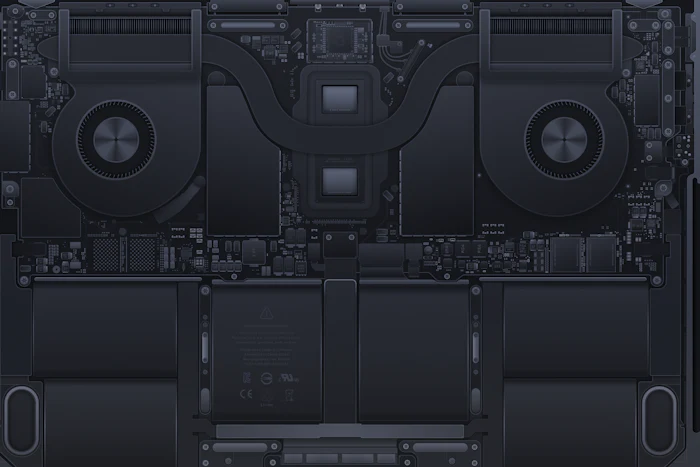 Interior de un MacBook Pro con los ventiladores, la placa lógica y las baterías a la vista